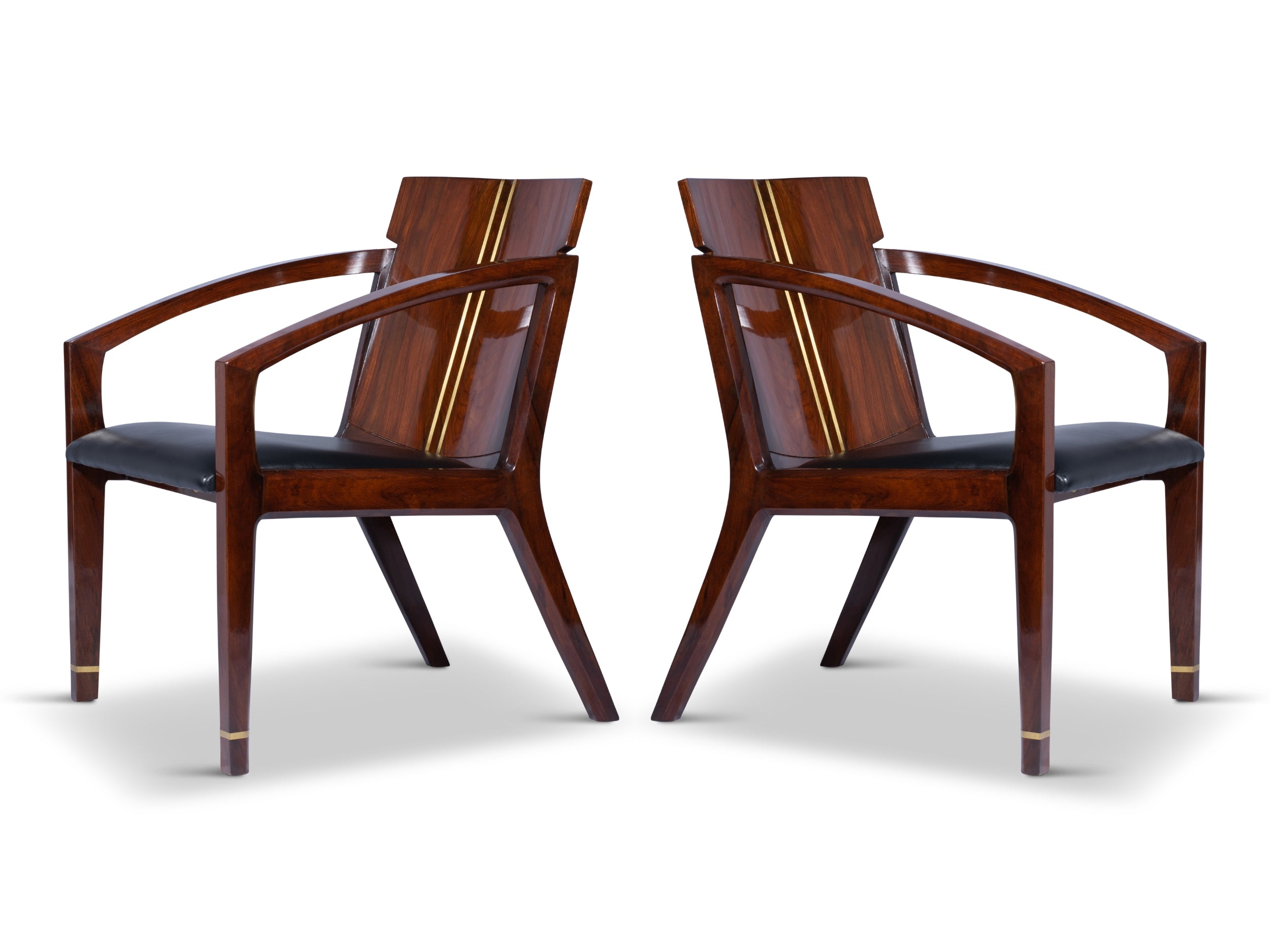 Two Pegasus solid wood accent chairs facing each other against white background