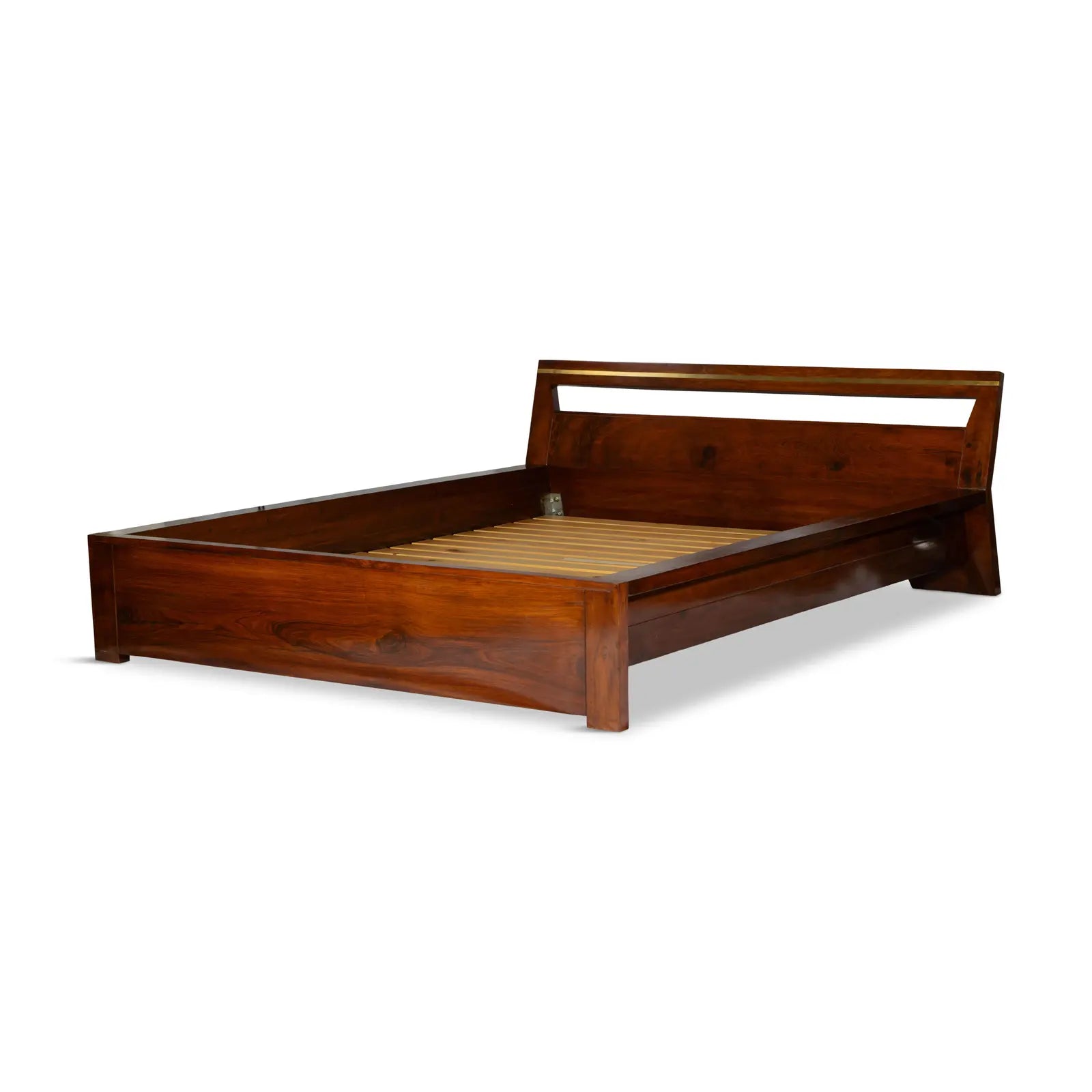Angled view of the rosewood platform bed showcasing minimalist profile and tapered headboard